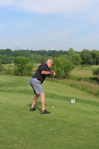 Man swinging golf club