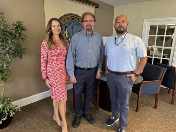 One woman, Sarah, with two men.