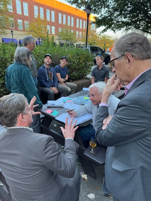 People having fun around table.