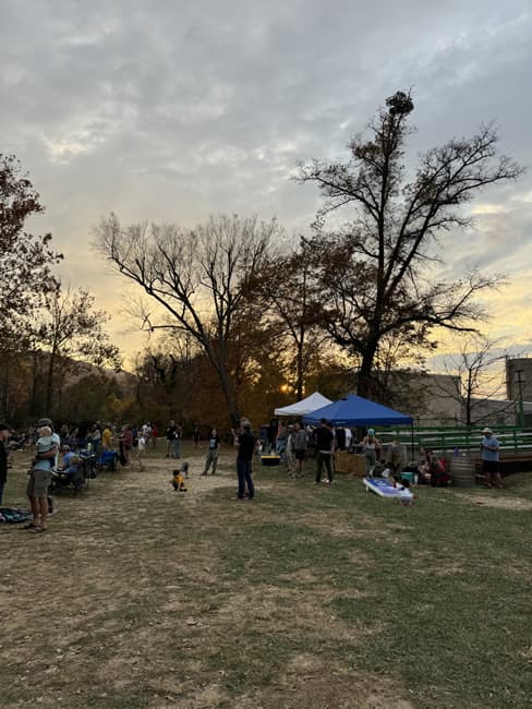 People mingling outdoors at an event.