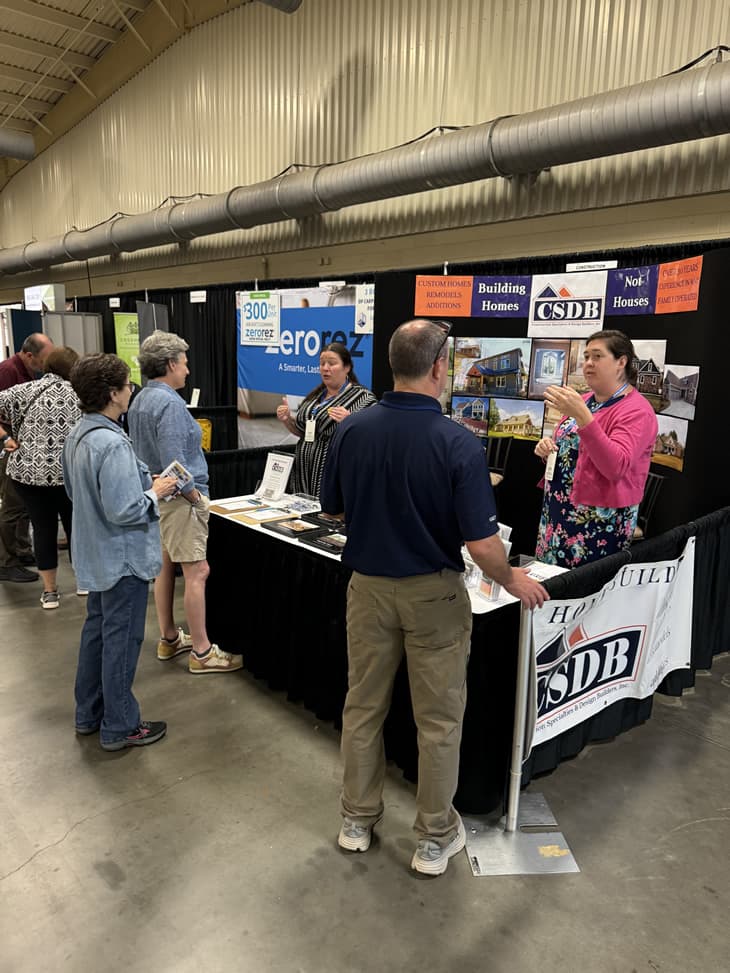 Booth with people talking.