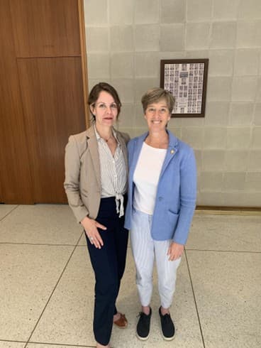 Two women members at NCHBA Q2 2025 meeting.