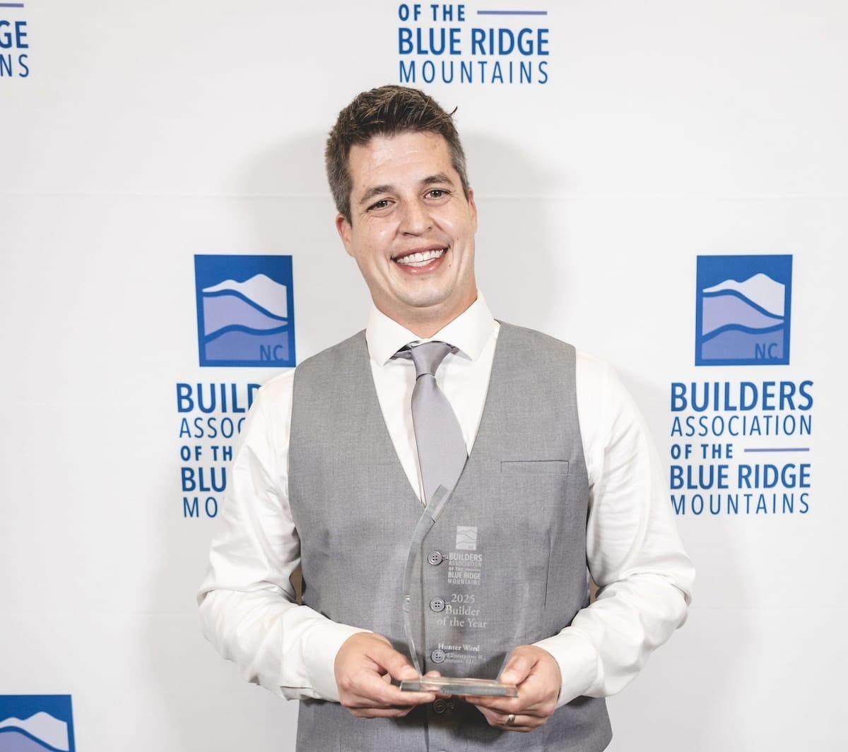 Hunter Ward holding his award for 2025 Builder of the Year